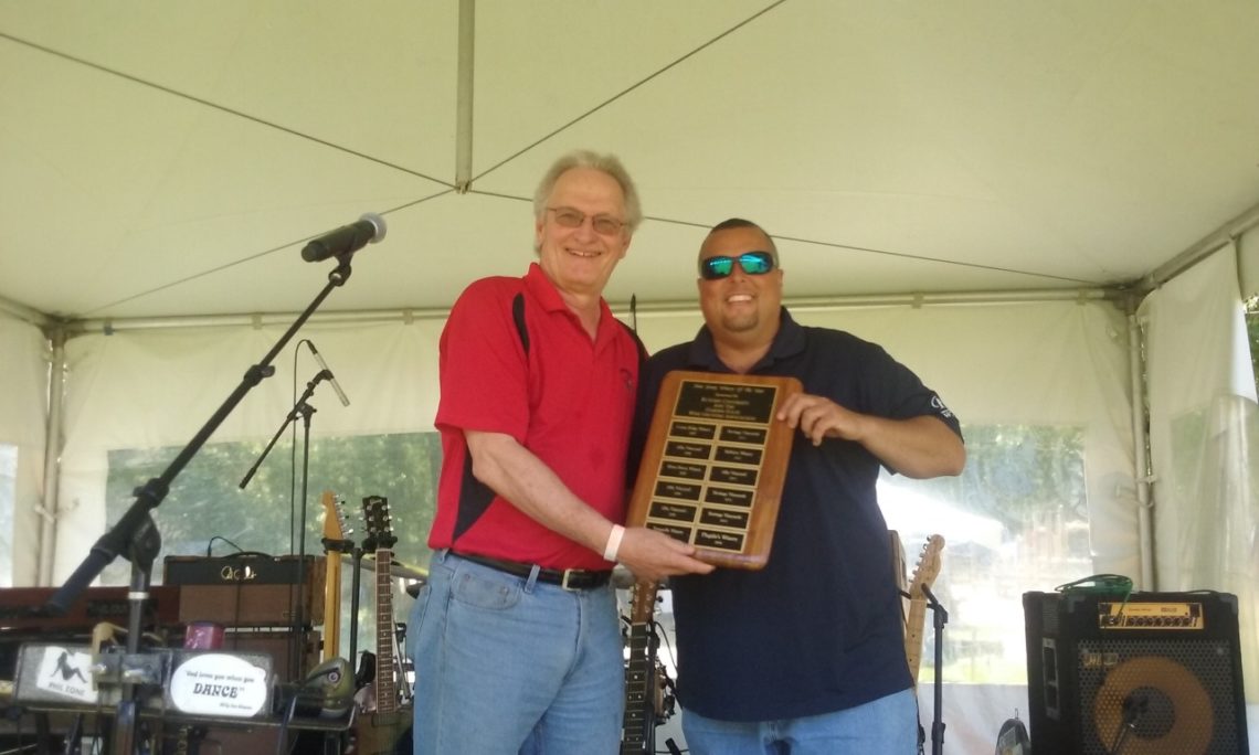 Ollie Tomasello of Plagido’s Winery accepts the Winery of the Year award from Dr. Gary Pavlis of Rutgers